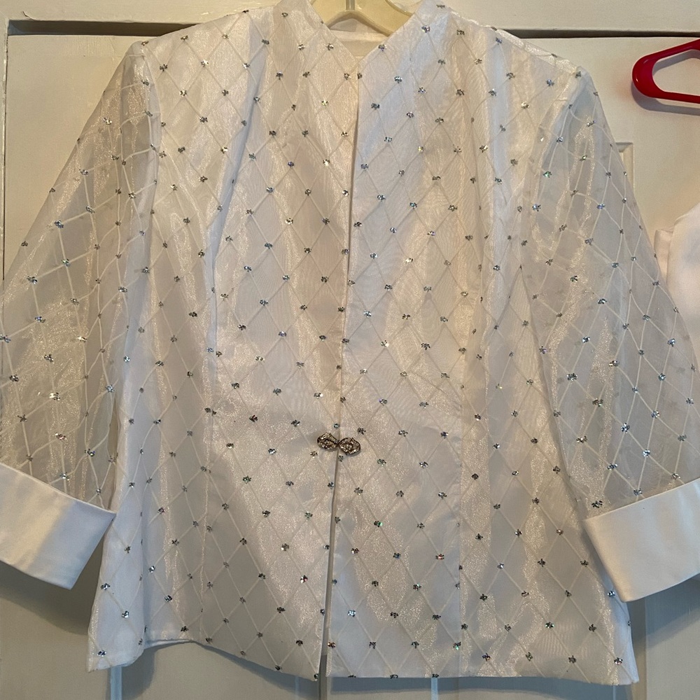 Never worn! Jacket with sheer sleeve and glitter detail. Comes with cami